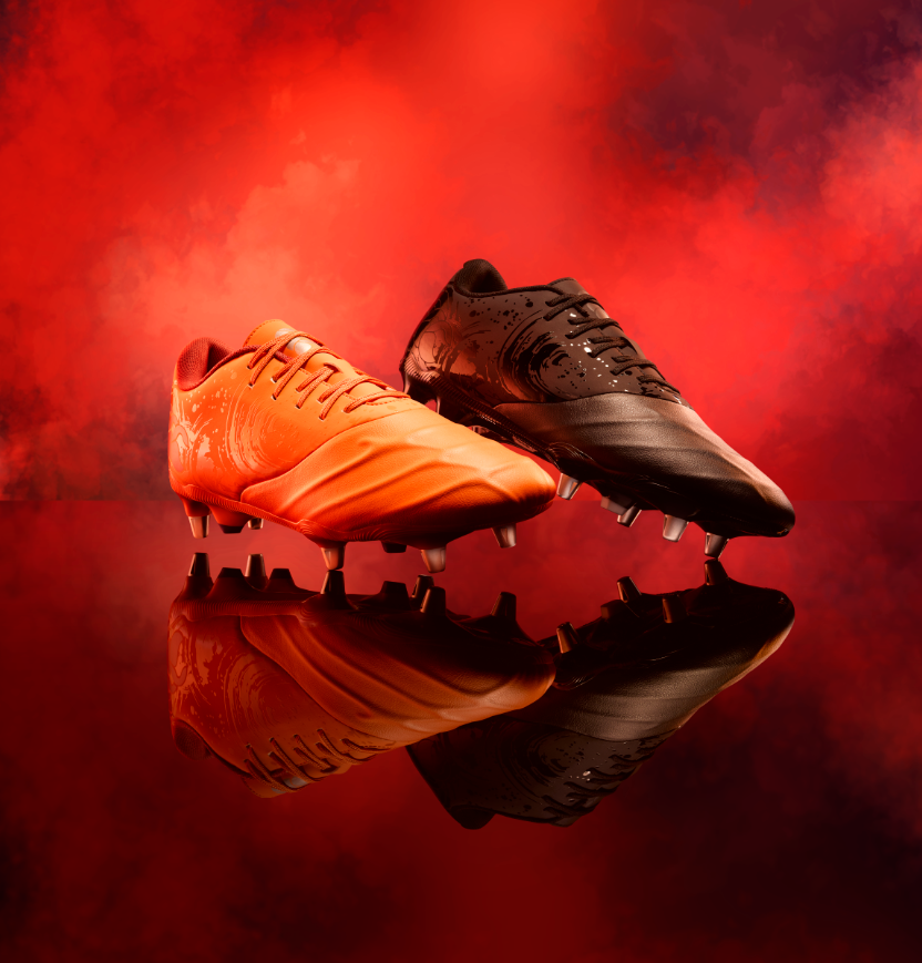 Canterbury Phoenix Genesis Team Rugby Boots in Orange & Black. Available at Lovell Rugby